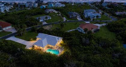 Lovely oceanside heated pool home with beach access a short stroll away!