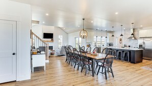 A spacious kitchen with a dining area, wooden flooring, and modern appliances. - Walk to the Amish Village: Spacious Ronks Getaway! (Ronks)