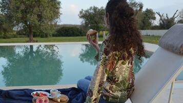 Seasonal outdoor pool, pool loungers