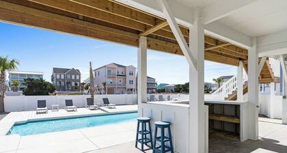 At Last is a newly built 5 bedroom 5 bathroom home with a private pool, elevator, tiki bar and so much more including a short walk to the beach!