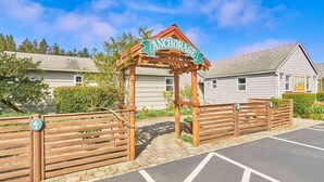 A wooden archway with the name "ANCHORAGE" above a gated entrance.