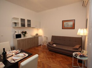 Apartment (Comfort One Bedroom Apartment with Ba) | Living room | 32-inch flat-screen TV with cable channels - Old Town Zadar Cozy and Comfy Apartments (Zadar)
