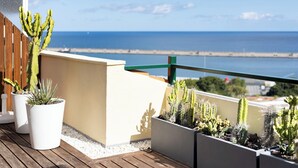 A balcony with potted cacti and a view of the sea. - Home2Book Chic Penthouse with Terrace, Santa Cruz (Santa Cruz de Tenerife)