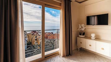 Deluxe Suite, Patio, Sea View | Living area | 28-inch Smart TV with satellite channels