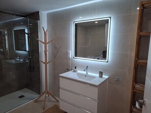 Shower, hair dryer, towels, soap