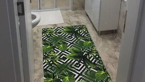 A bathroom with a shower, toilet, sink, and a cabinet. - Söğüt Butik Apart (Sögüt)