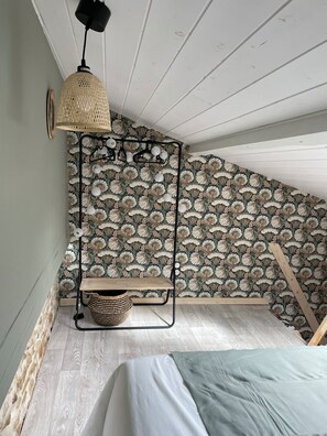 1 bedroom, desk, iron/ironing board, travel crib