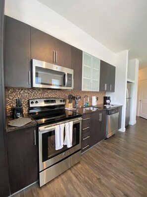 Stainless steel appliances USB Ports in kitchen Custom Italian cabinetry