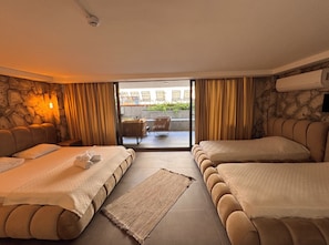 Family Quadruple Room, Lanai | In-room safe, bed sheets