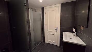 Family Quadruple Room, Lanai | Bathroom | Shower, hair dryer, slippers, towels