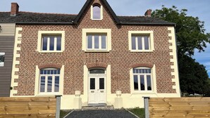 A two-story brick house with a symmetrical facade, white-framed windows, and a central entrance with a small porch. - Quiet country house (Houdain-lez-Bavay)