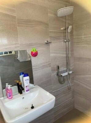 Shower, hair dryer, towels, soap