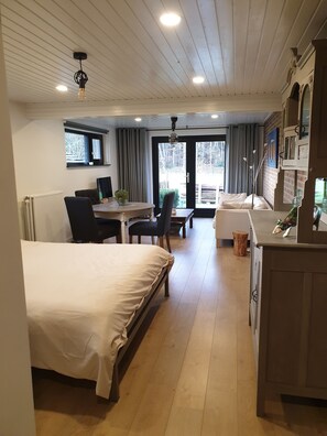Living room - Spacious Studio, in wooded hiking/biking area. Near ASML. (Knegsel)