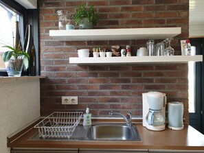 Fridge, microwave, stovetop, coffee/tea maker