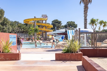 Indoor pool, a heated pool. Mobile Home 'Family's Dream P16 La Marina' with Shared Pool, Private Terrace and Air Conditioning
