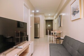 Condo, 1 Bedroom, Balcony | Living room - Pool & Garden Tranquility (Iloilo)