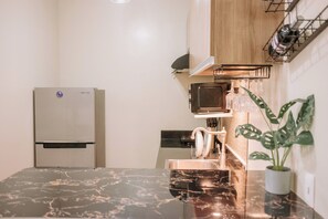 Condo, 1 Bedroom, Balcony | Private kitchen - Playful & Charming City Loft (Iloilo)