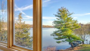 A view through a window of a lake with trees and a dock. - Billingswood by Boutiq (Athens)
