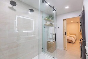 Shower, hair dryer, towels, shampoo