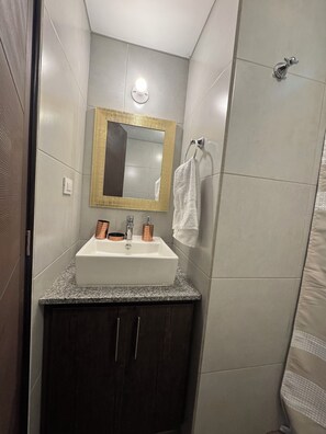 Shower, hair dryer, towels, soap