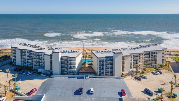 A modern hotel with a rooftop pool and ocean views. -  Spacious Ormond Oceanfront  3 bedroom Condo (Ormond Beach)