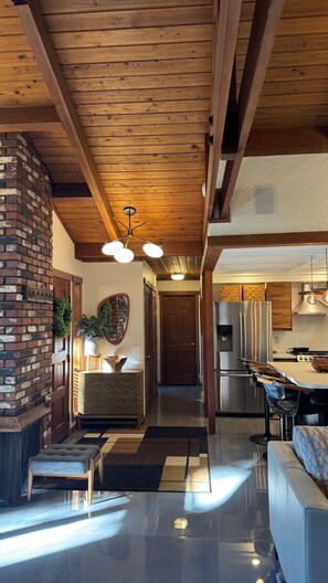 A modern kitchen with a stainless steel refrigerator, a built-in oven, and a gas stove. - Mid-Century Modern Beauty - Movie Theater, AC! (Beaverton)