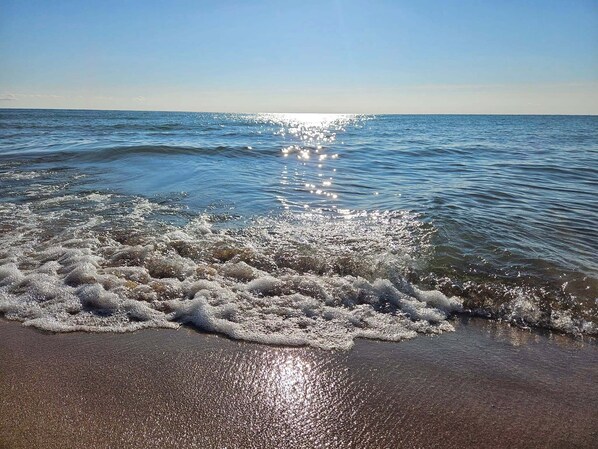 On the beach, sun-loungers