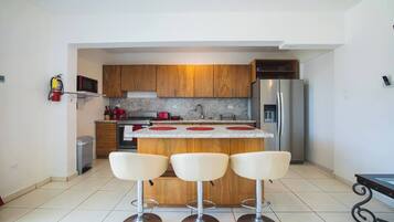 Fridge, microwave, stovetop, coffee/tea maker