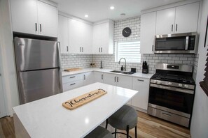 Fridge, microwave, stovetop, coffee/tea maker
