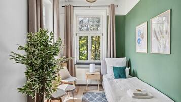 4 habitaciones, tabla de planchar con plancha, cuna de viaje y wifi