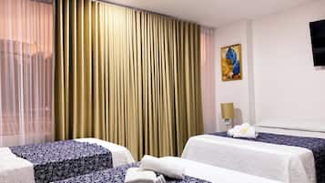 Habitación familiar | Escritorio, wifi gratis y ropa de cama