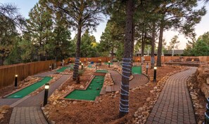 Play a round of golf amidst lush surroundings and winding paths.