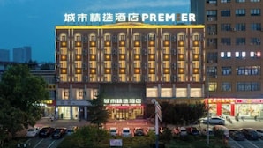 A hotel with a prominent sign reading "City Premier Hotel". - City Comfort Premier Hotel (Bozhou Weiwu Plaza) (Bozhou)