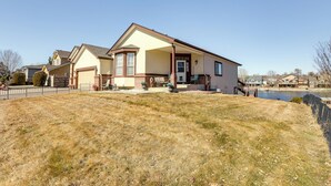 A two-story house with a garage, a front porch, and a small front yard. - 7 Mi to Dtwn Denver: Lakefront Gem w/ Dock! (Denver)
