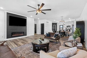 Smart TV, fireplace, table football, books