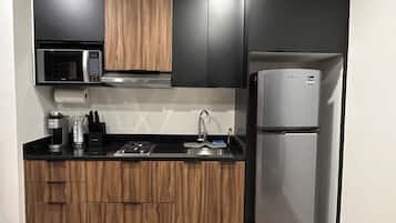 Fridge, microwave, coffee/tea maker, cookware/dishes/utensils