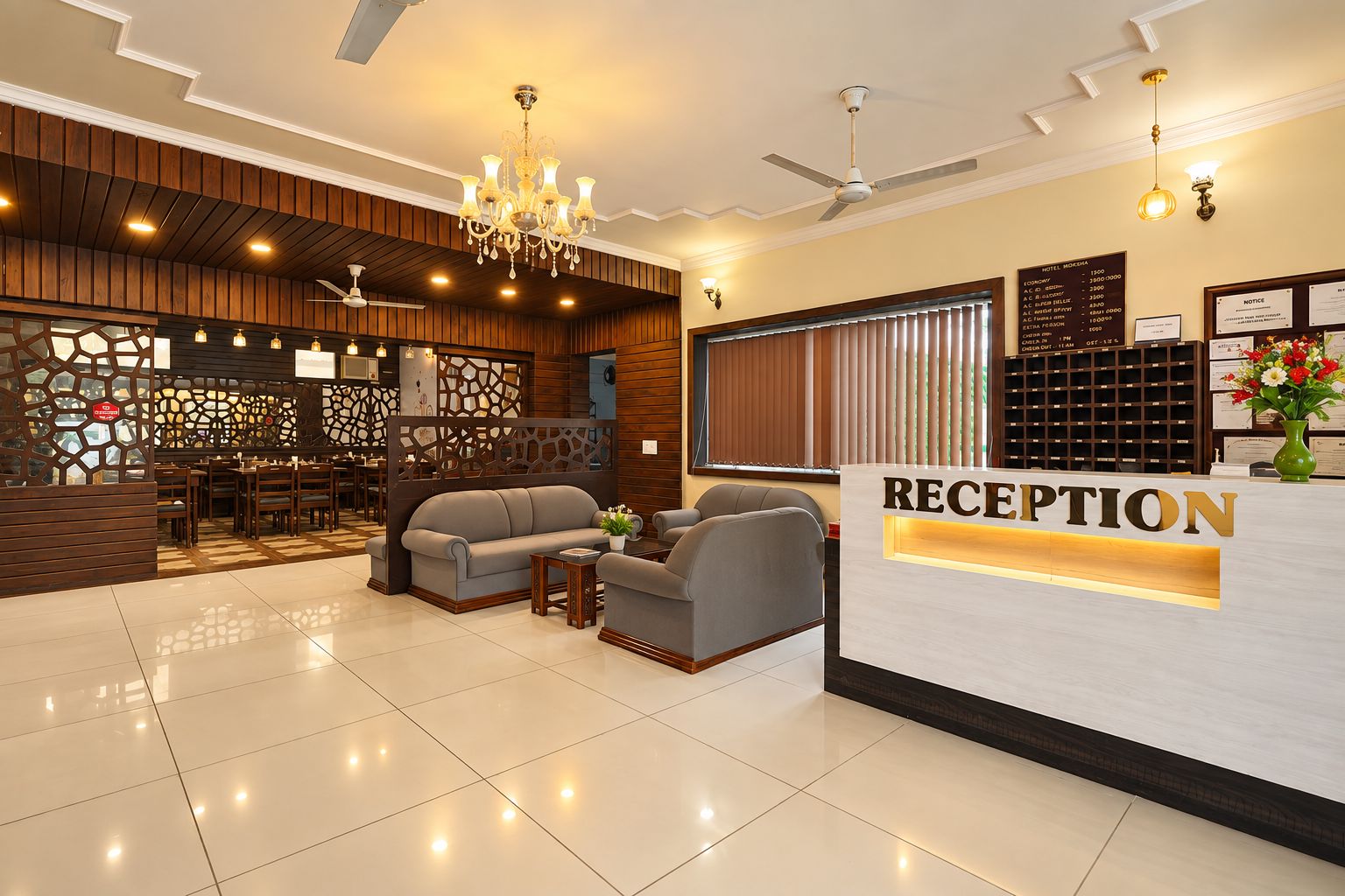 A reception area with a reception desk, seating, a chandelier, and a view of the hotel interior.