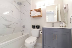 Shower, hair dryer, towels