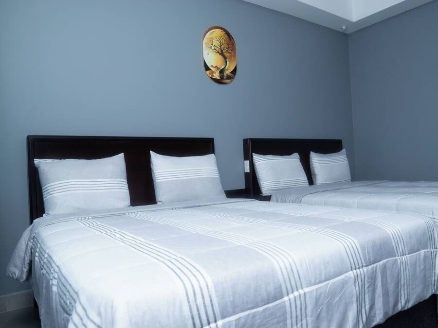 Exclusive Suite, Multiple Beds, Kitchenette, Courtyard View | 1 bedroom, iron/ironing board, free WiFi
