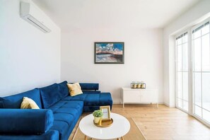 Deluxe Apartment, Patio, Sea View | Living area