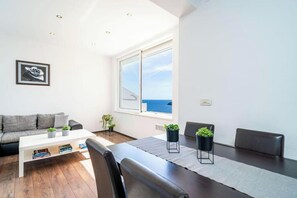 Deluxe Apartment, 1 Bedroom, Balcony, Sea View | In-room safe, soundproofing, iron/ironing board, free WiFi