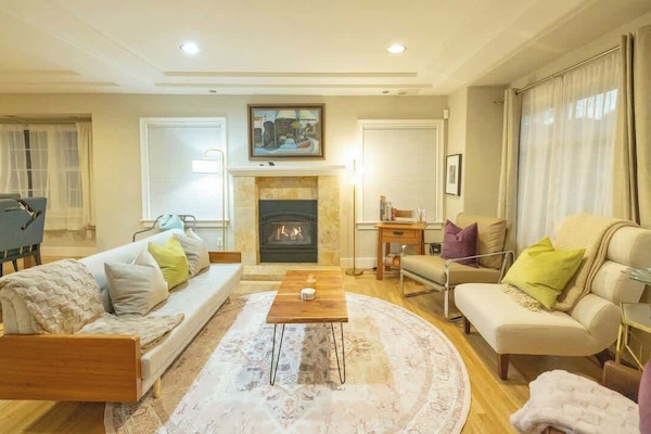 Relax and enjoy cozy seating besides the fireplace