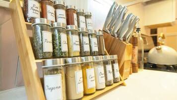 A spice rack with labeled jars of various spices.