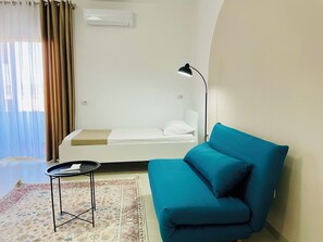 1 bedroom, desk, iron/ironing board, travel crib