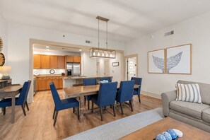 A modern kitchen with wooden cabinets and a stainless steel refrigerator. - Redfish Village M2-329 - 3BR/3BA Corner Condo - Sleeps 12 - Community Pool (Blue Mountain Beach)