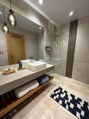 Shower, hair dryer, towels, soap