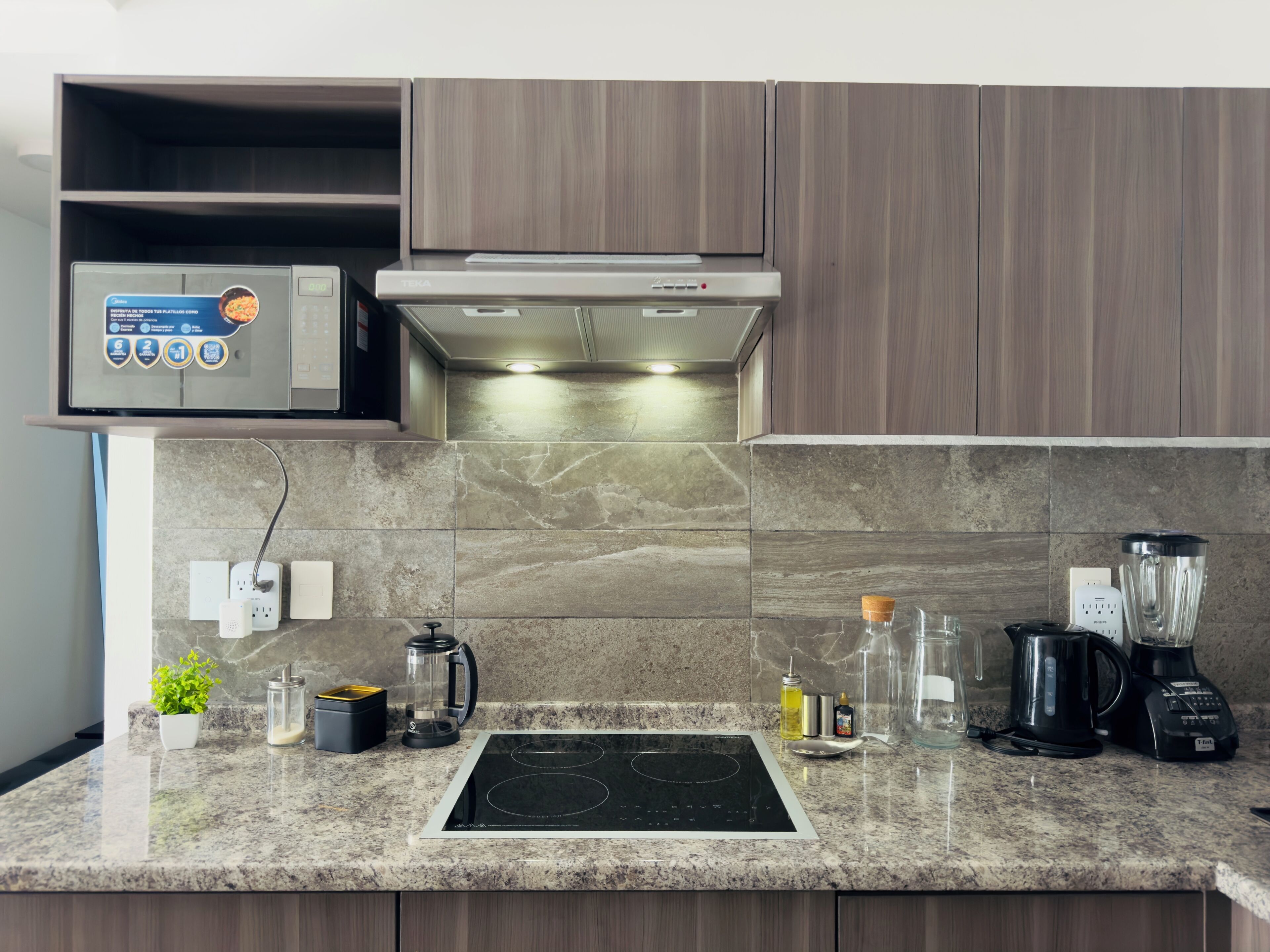 Microwave, stovetop, coffee/tea maker, electric kettle