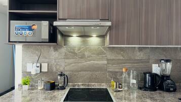 Microwave, stovetop, coffee/tea maker, electric kettle