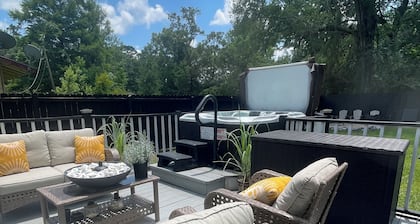 Tiny house with hot tub, kids play area, and fire pit