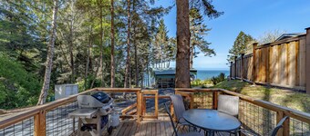Comfy oceanside retreat, forested creekside setting, expansive grounds over ocean bluffs